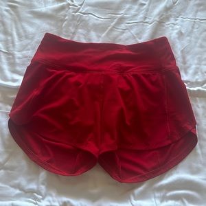 Red size 2, 4 inch speed up Lululemon shorts. Worn once.